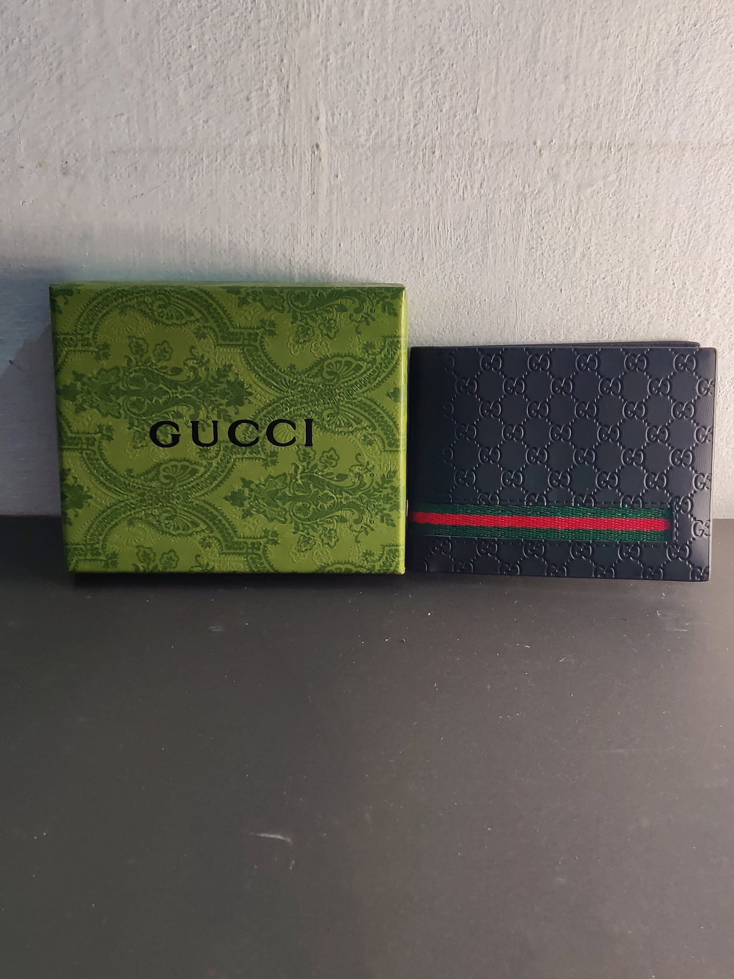 Gucci Bi-fold Wallet in Black Embossed Leather